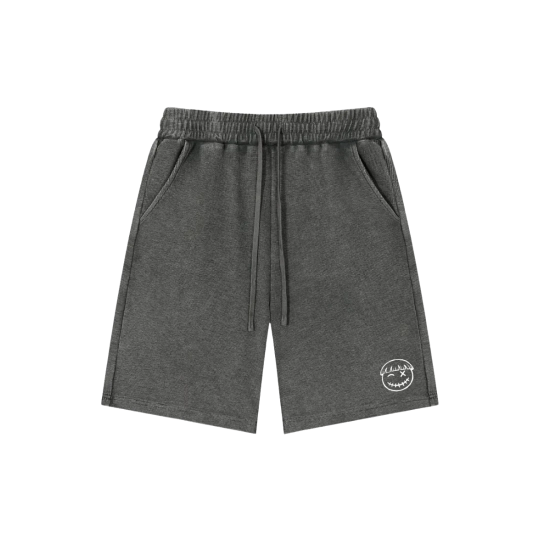 Asphalt gray snow wash shorts — front, tonal PM smiley patch on the hip