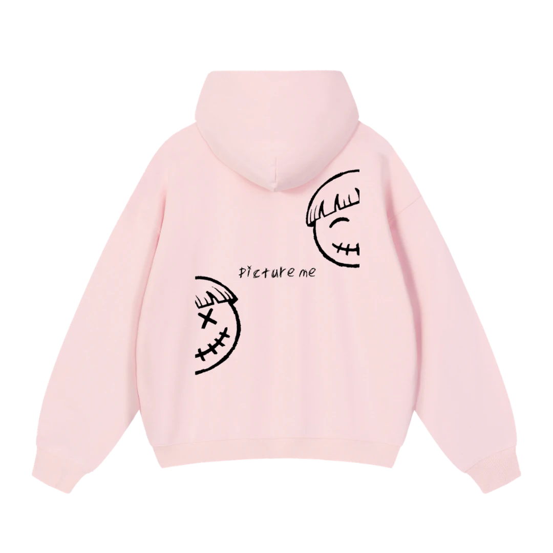 Baby pink graphic hoodie — back, two split half-smiley faces with a "picture me" script