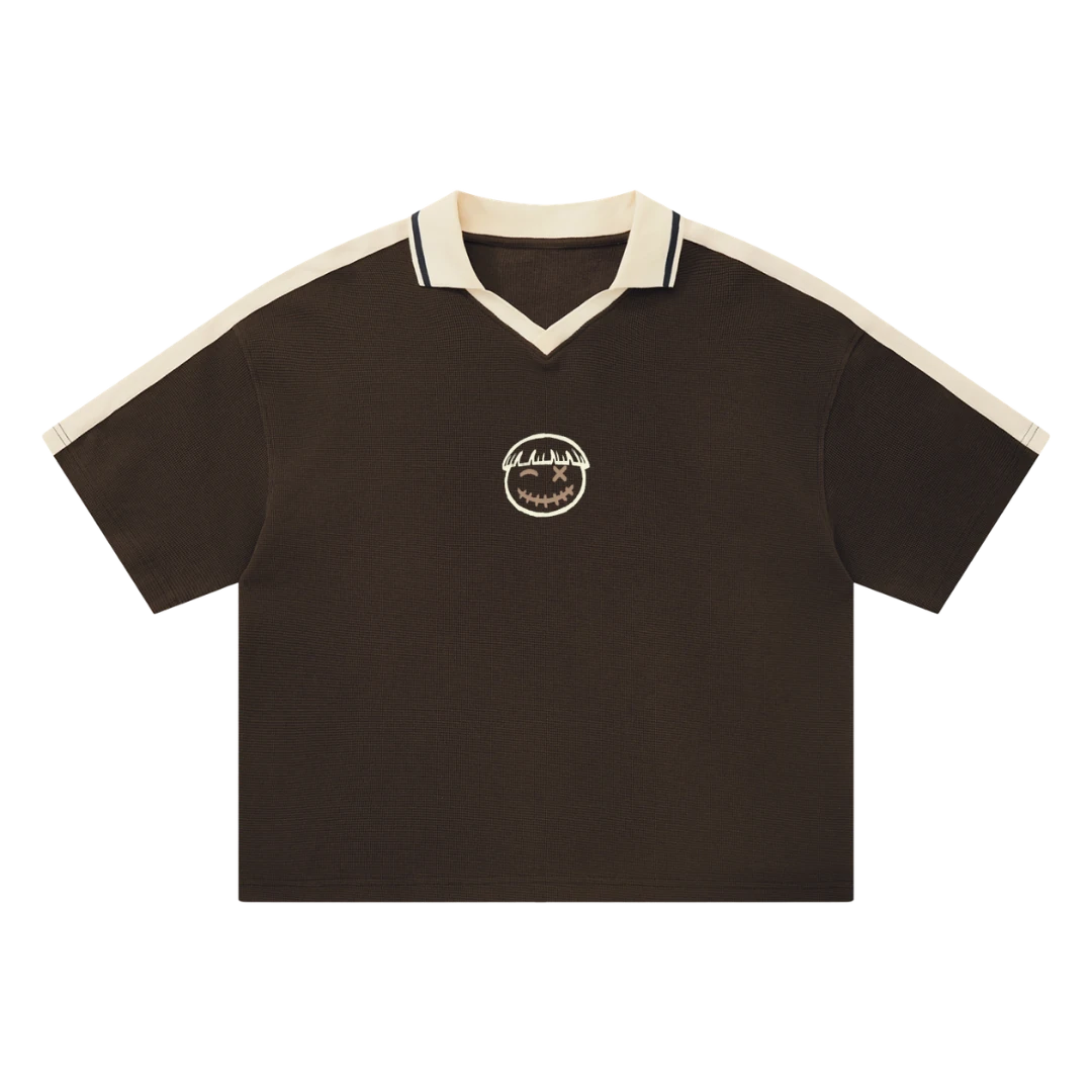 Brown waffle knit polo — front, cream tipped collar and shoulder trim