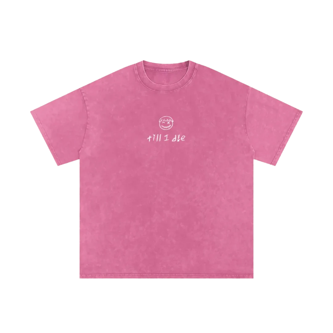 Bubble gum pink final cut tee — front, PM smiley and "till i die" script on the chest