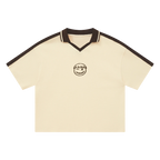 Cream waffle knit polo — front, chocolate-brown colorblock V-neck placket
