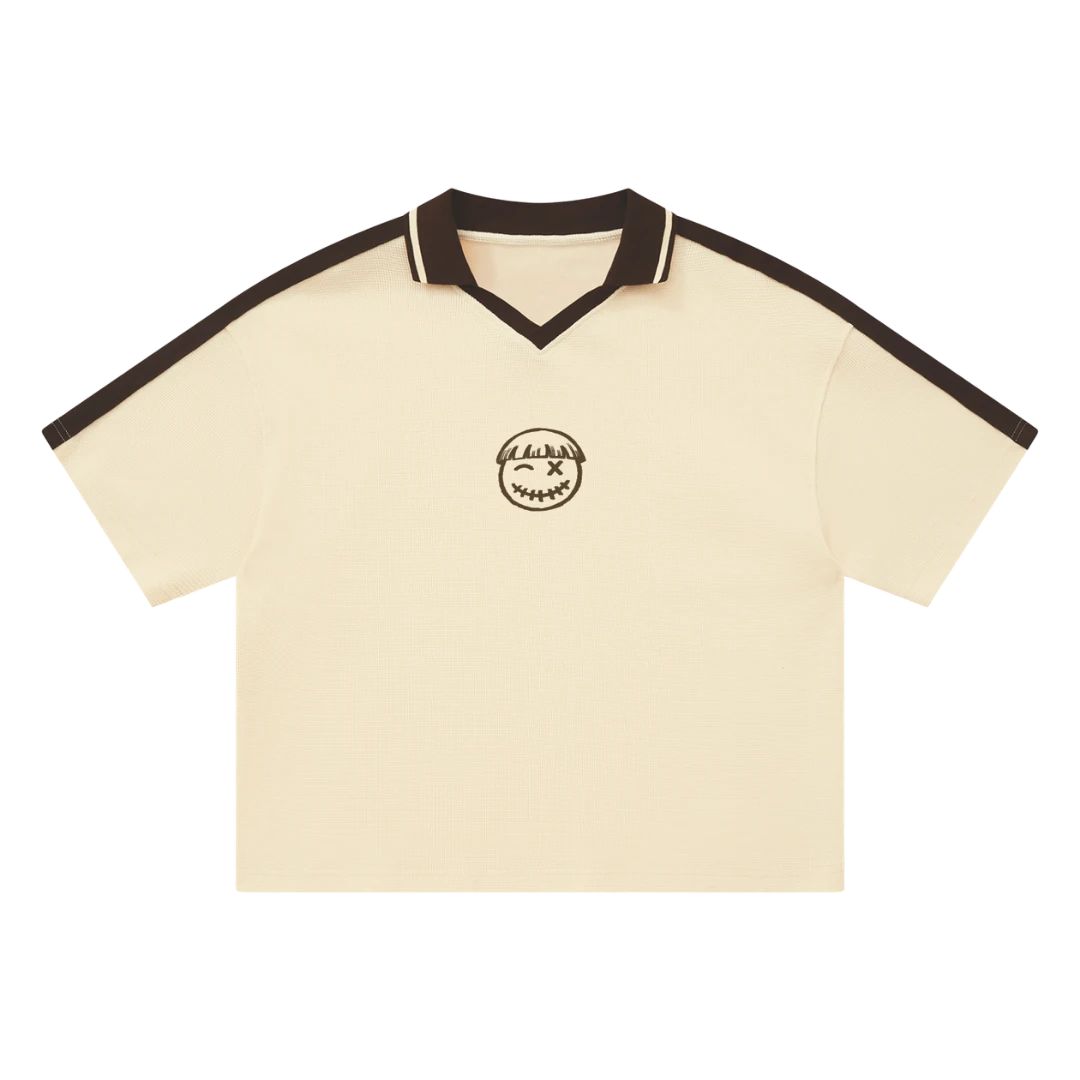 Cream waffle knit polo — front, chocolate-brown colorblock V-neck placket