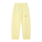 Lemon yellow wide-leg sweatpants — front, tonal PM smiley patch on the hip