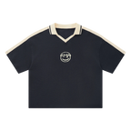 Navy waffle knit polo — front, cream tipped collar and shoulder trim