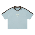 Ocean blue waffle knit polo — front, espresso-brown tipped collar and shoulder trim