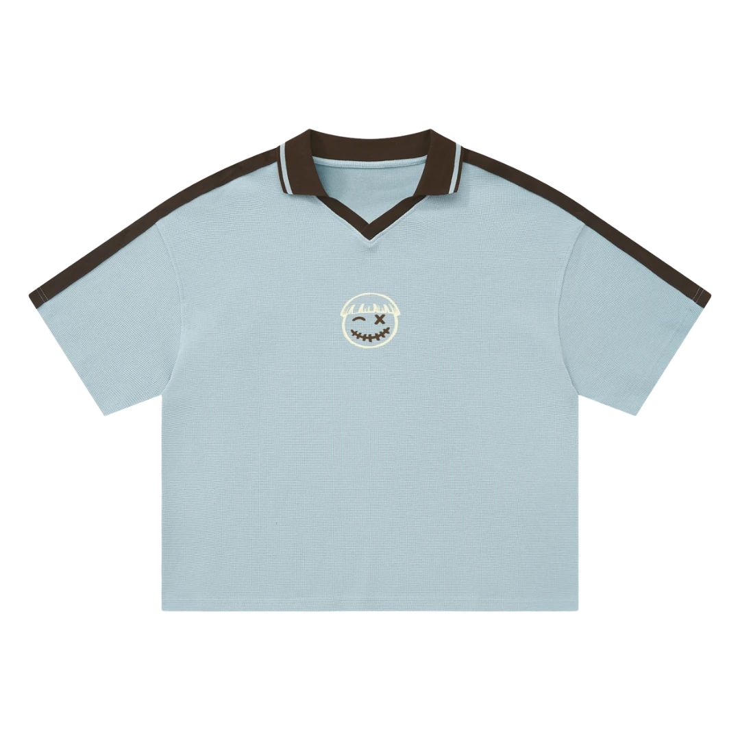 Ocean blue waffle knit polo — front, espresso-brown tipped collar and shoulder trim