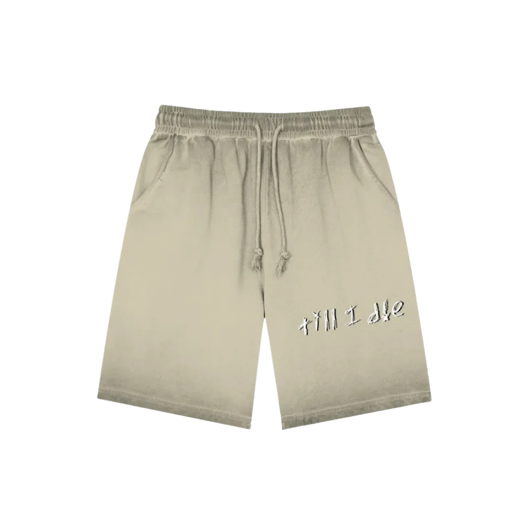 Outland khaki graphic shorts — front, hand-scrawled "till i die" script on the thigh, ombre fade