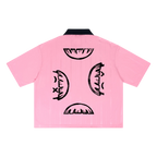 Pink soccer jersey — back, four half-smiley faces printed top, bottom, and both sides