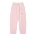 Pink wide-leg sweatpants — front, tonal PM smiley patch on the hip