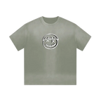 Pistachio green smiley tee — front, oversized PM smiley outline on the chest