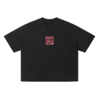 PM earring graphic tee — front, PM smiley framed in a small square on the chest