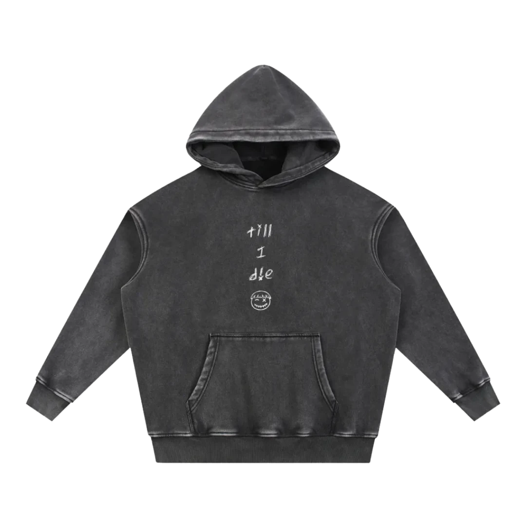 Washed black pullover hoodie — front, "till / i / die" stacked print with the PM smiley